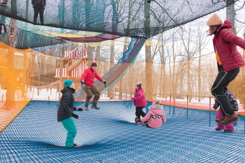 Family on trampoline at upla park