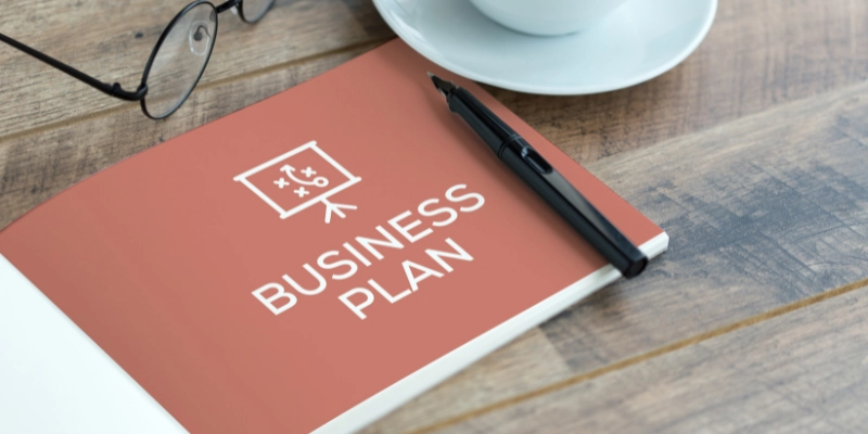 Business plan booklet on desk