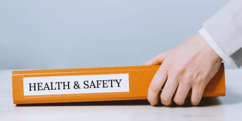 Health and safety binder on tabletop