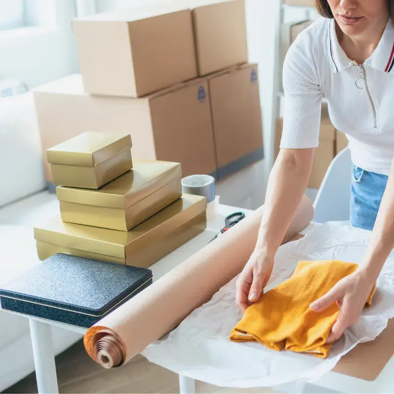 Small business owner preparing a package for shipment