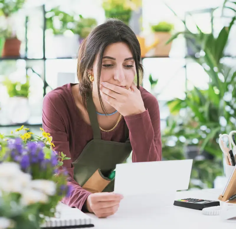 Small business owner looking at her laptop